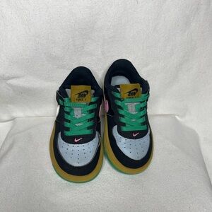 Nike Kids Black and Gold Sneakers with Pink Accents
